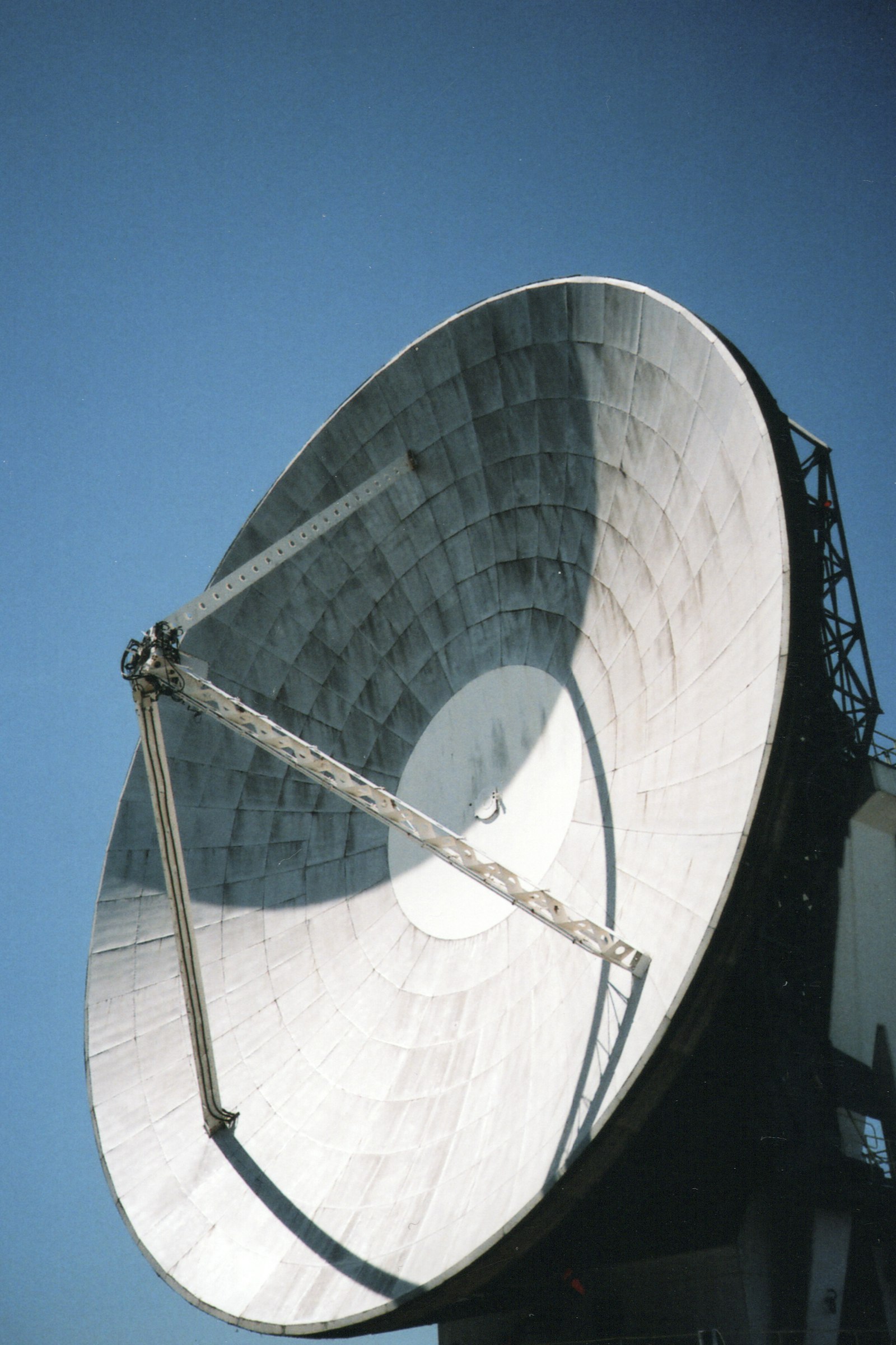 Large satellite dish against a clear sky